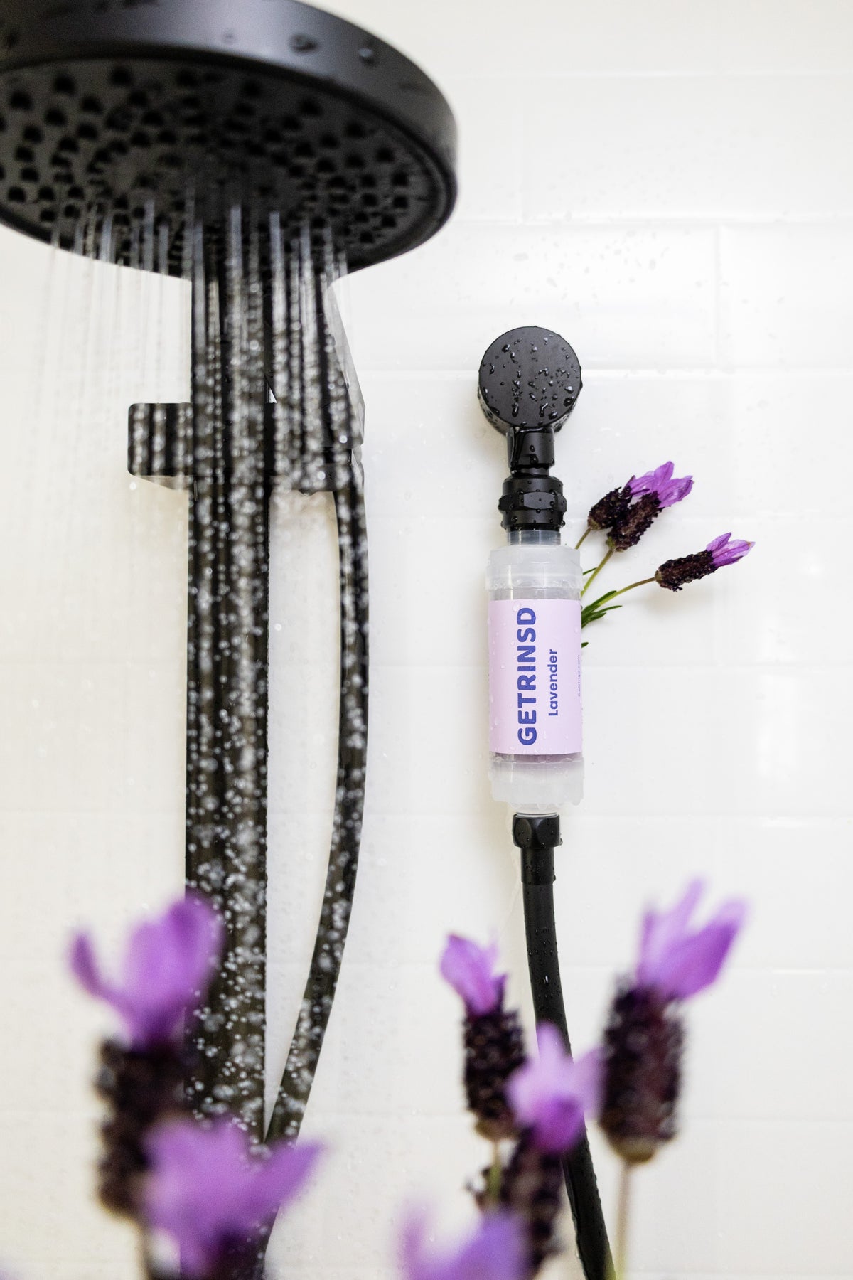 GETRINSD Vitamin C Aroma Shower Filter with lavender scent, showcasing the filter cartridge and soothing lavender aroma.