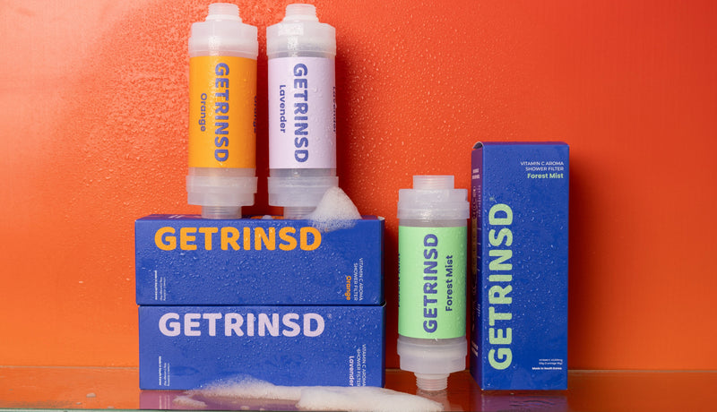 GETRINSD Vitamin C Trio Bundle showing three bottles of vitamin C supplements with bright orange labels and capsules inside.