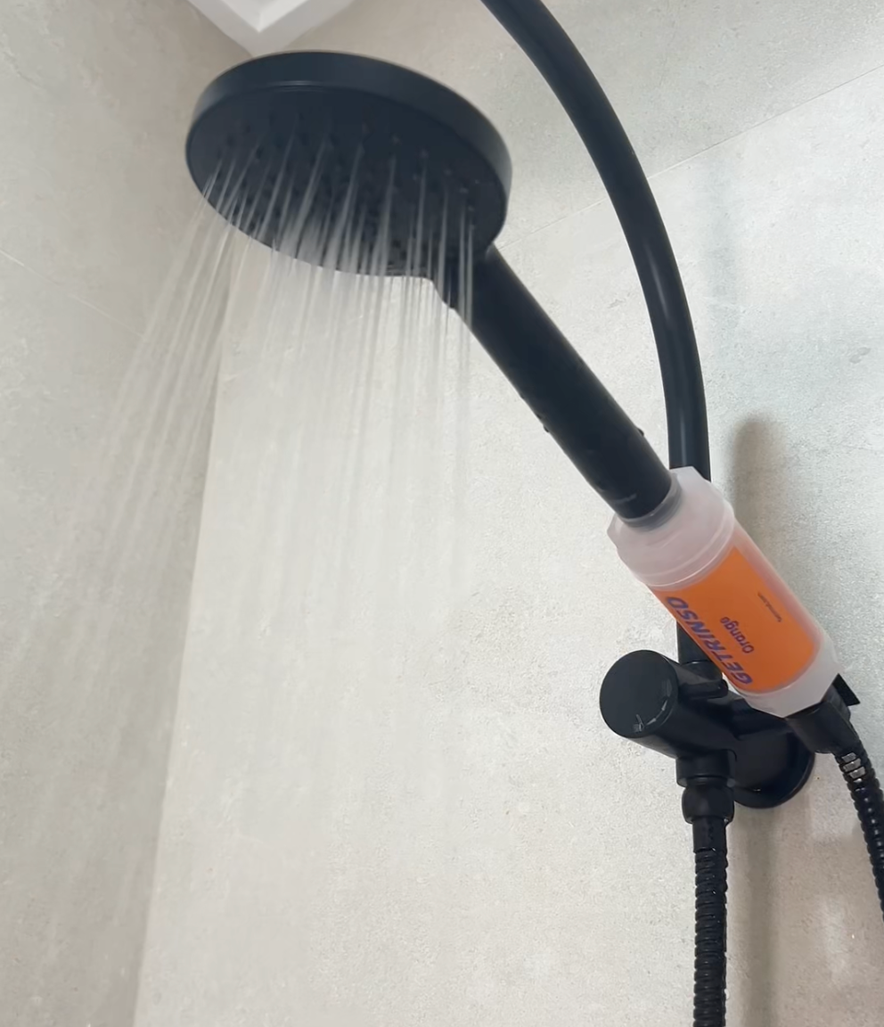 GETRINSD Vitamin C Aroma Shower Filter with orange scent, showing the filter cartridge and packaging for refreshing shower experience.